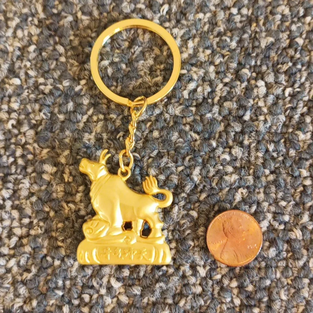 Good luck Cow keychain gold tone